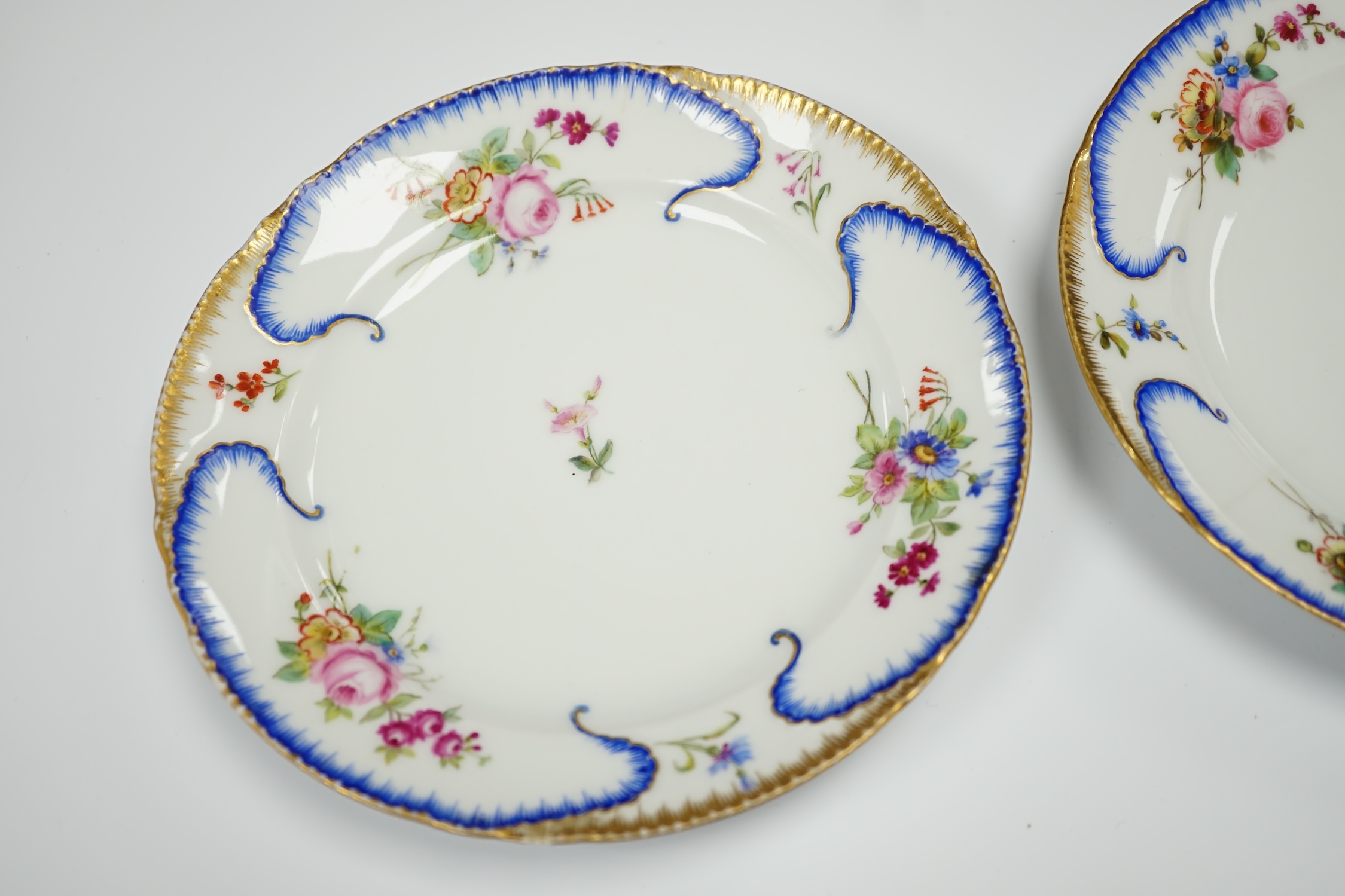 A pair of Alexander II Russian Imperial porcelain ‘Peterhof-Palast’ floral rim plates, 19cm (a.f.)